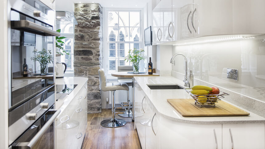 Sleek kitchen with reflective high gloss cabinets