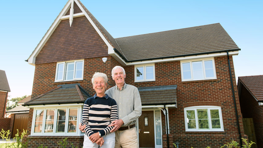 Rogan and Lesley outside their new home