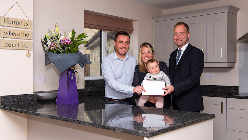 The Dodd family in their new home