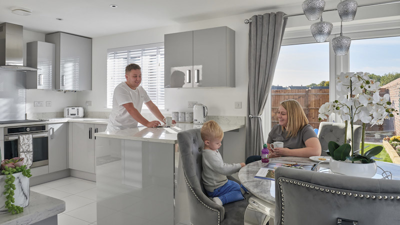 Emma and her family in their new build home