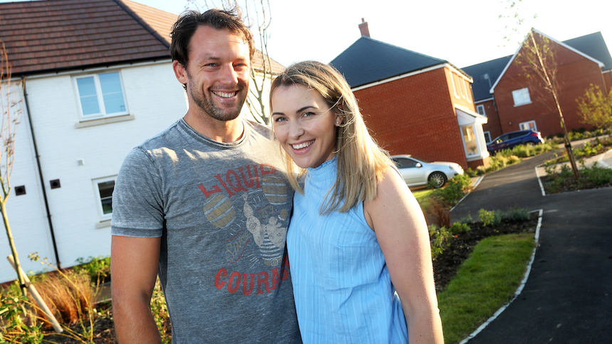 Matt and Claire outside their new home