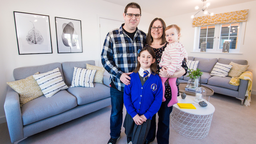 Simon and Anna with their family in their new home